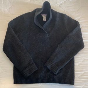 Minor pilling on back of sleeves.